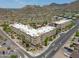 Beautiful aerial view of the apartment complex surrounded by desert landscape and mountain views, offering stunning scenery at 9820 N Central Ave # 212, Phoenix, AZ 85020