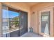 The balcony has glass doors and a small sitting area for relaxing and enjoying the outdoors at 9820 N Central Ave # 212, Phoenix, AZ 85020