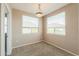 Bedroom with neutral carpet, two windows, and a ceiling fan at 9820 N Central Ave # 212, Phoenix, AZ 85020
