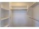 White walk-in closet featuring multiple shelves and rods at 9820 N Central Ave # 212, Phoenix, AZ 85020