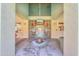 Inviting entrance to the community with a unique water feature and secure gated access at 9820 N Central Ave # 212, Phoenix, AZ 85020