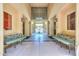 Well-decorated entryway sitting area featuring benches and tile flooring at 9820 N Central Ave # 212, Phoenix, AZ 85020