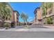 Low angle exterior of community buildings featuring manicured lawns and landscaping at 9820 N Central Ave # 212, Phoenix, AZ 85020