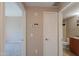 View down hallway to carpeted room and bathroom at 9820 N Central Ave # 212, Phoenix, AZ 85020