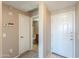 Hallway view to bathroom and entrance door at 9820 N Central Ave # 212, Phoenix, AZ 85020