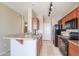 Kitchen featuring tile flooring, wood cabinets, and stainless steel appliances at 9820 N Central Ave # 212, Phoenix, AZ 85020