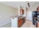 Kitchen featuring tile flooring, wood cabinets, and stainless steel appliances at 9820 N Central Ave # 212, Phoenix, AZ 85020