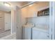 Convenient laundry room features washer and dryer hookups and shelving at 9820 N Central Ave # 212, Phoenix, AZ 85020