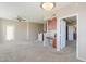 Bright, carpeted living room with ceiling fan and access to the outdoors at 9820 N Central Ave # 212, Phoenix, AZ 85020
