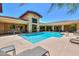 Community pool area with ample seating, shaded areas, and well-maintained landscaping at 9820 N Central Ave # 212, Phoenix, AZ 85020