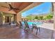 Inviting community pool and lounge area with shaded seating and lush landscaping creating a resort atmosphere at 9820 N Central Ave # 212, Phoenix, AZ 85020