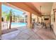 Community pool and lounge area with shaded seating and lush landscaping creating a resort atmosphere at 9820 N Central Ave # 212, Phoenix, AZ 85020