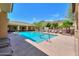 Community pool with mountain views and comfortable lounge chairs under a bright blue sky at 9820 N Central Ave # 212, Phoenix, AZ 85020