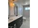 Modern bathroom features a double vanity, decorative mirrors, and shower with patterned tile at 1010 W 13Th St, Tempe, AZ 85281
