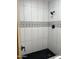 Stylish bathroom shower with black shower head, patterned tiles and modern tile surround at 1010 W 13Th St, Tempe, AZ 85281