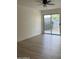 Bright bedroom features sliding glass doors and a ceiling fan for comfort at 1010 W 13Th St, Tempe, AZ 85281