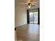 Cozy bedroom with fan, wood-look floors, and a sliding glass door at 1010 W 13Th St, Tempe, AZ 85281