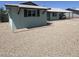Single-story home with a well-kept exterior, desert landscaping, and covered parking at 1010 W 13Th St, Tempe, AZ 85281