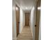 Bright hallway boasts new flooring, clean walls, and contrasting doors and hardware at 1010 W 13Th St, Tempe, AZ 85281