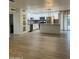 Open-concept kitchen with white cabinets, stainless steel appliances, an island, and modern backsplash at 1010 W 13Th St, Tempe, AZ 85281