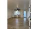 Bright living room featuring wood-look floors, a ceiling fan, and ample natural light from the windows at 1010 W 13Th St, Tempe, AZ 85281