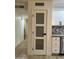 A modern pantry door is shown with stainless steel appliances and decorative backsplash at 1010 W 13Th St, Tempe, AZ 85281