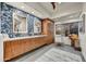 Bathroom featuring wood cabinets, double sinks, and a window with natural light at 10638 E Honey Mesquite Dr, Scottsdale, AZ 85262