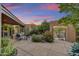 Intimate outdoor seating area surrounded by lush vegetation and desert landscape at 10638 E Honey Mesquite Dr, Scottsdale, AZ 85262