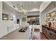 Bright dining area with modern light fixture, sleek dining table, and decorative accents at 10638 E Honey Mesquite Dr, Scottsdale, AZ 85262