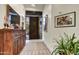 Bright foyer with stylish decor and an inviting view of the home's desert landscape at 10638 E Honey Mesquite Dr, Scottsdale, AZ 85262