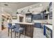Open concept kitchen features large island, stainless steel appliances, and sleek cabinetry at 10638 E Honey Mesquite Dr, Scottsdale, AZ 85262