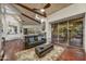 Relaxing living room with wood floors, comfortable furniture, and scenic views of the yard at 10638 E Honey Mesquite Dr, Scottsdale, AZ 85262