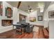 Inviting living room with wooden ceiling beams, fireplace, and comfortable leather seating at 10638 E Honey Mesquite Dr, Scottsdale, AZ 85262