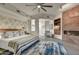 Beautiful main bedroom featuring a stone fireplace, sitting area, and elegant decor at 10638 E Honey Mesquite Dr, Scottsdale, AZ 85262