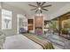 A spacious main bedroom with a fireplace, sitting area, and a large window view at 10638 E Honey Mesquite Dr, Scottsdale, AZ 85262