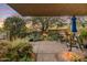 Relaxing outdoor patio surrounded by lush desert landscaping and scenic sunset views at 10638 E Honey Mesquite Dr, Scottsdale, AZ 85262