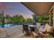 Stylish covered patio with comfortable seating and pool views, perfect for outdoor relaxation at 10638 E Honey Mesquite Dr, Scottsdale, AZ 85262