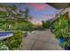 Inviting pool area with beautiful landscaping, tile accents, and gorgeous sunset views at 10638 E Honey Mesquite Dr, Scottsdale, AZ 85262