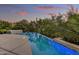 Sparkling pool with built-in hot tub surrounded by beautiful natural desert scenery at 10638 E Honey Mesquite Dr, Scottsdale, AZ 85262