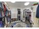 Well-organized walk-in closet with ample shelving and storage for clothes and shoes at 10638 E Honey Mesquite Dr, Scottsdale, AZ 85262