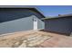 Backyard featuring access door and brick-lined landscaping area at 11012 E Elton Ave, Mesa, AZ 85208