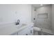 Modern bathroom with white marble walk-in shower, black hardware, and patterned floor tiles at 11012 E Elton Ave, Mesa, AZ 85208