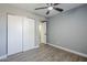 A bedroom features a closet and a door to another room at 11012 E Elton Ave, Mesa, AZ 85208