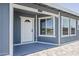 Covered entry featuring a half-light door, sidelight window, and a neatly painted exterior at 11012 E Elton Ave, Mesa, AZ 85208