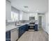 Updated kitchen with a new stainless steel appliance package and stylish two-tone cabinets at 11012 E Elton Ave, Mesa, AZ 85208