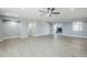 Spacious living room boasts recessed lighting, fan, and open access to other areas at 11012 E Elton Ave, Mesa, AZ 85208