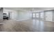 Open-plan living space with laminate flooring and great natural light exposure near the kitchen at 11012 E Elton Ave, Mesa, AZ 85208