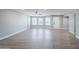 Spacious living room featuring laminate flooring, recessed lights, and ample natural light at 11012 E Elton Ave, Mesa, AZ 85208