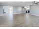 Open-concept living area with durable laminate flooring, neutral paint, and ample natural light at 11012 E Elton Ave, Mesa, AZ 85208