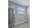 Utility room with water heater and modern wood-look vinyl plank flooring at 11012 E Elton Ave, Mesa, AZ 85208